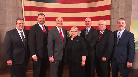 Gov. Ricketts (third from left), public education and business leaders at the announcement of the statewide “Commit to Complete” campaign.
